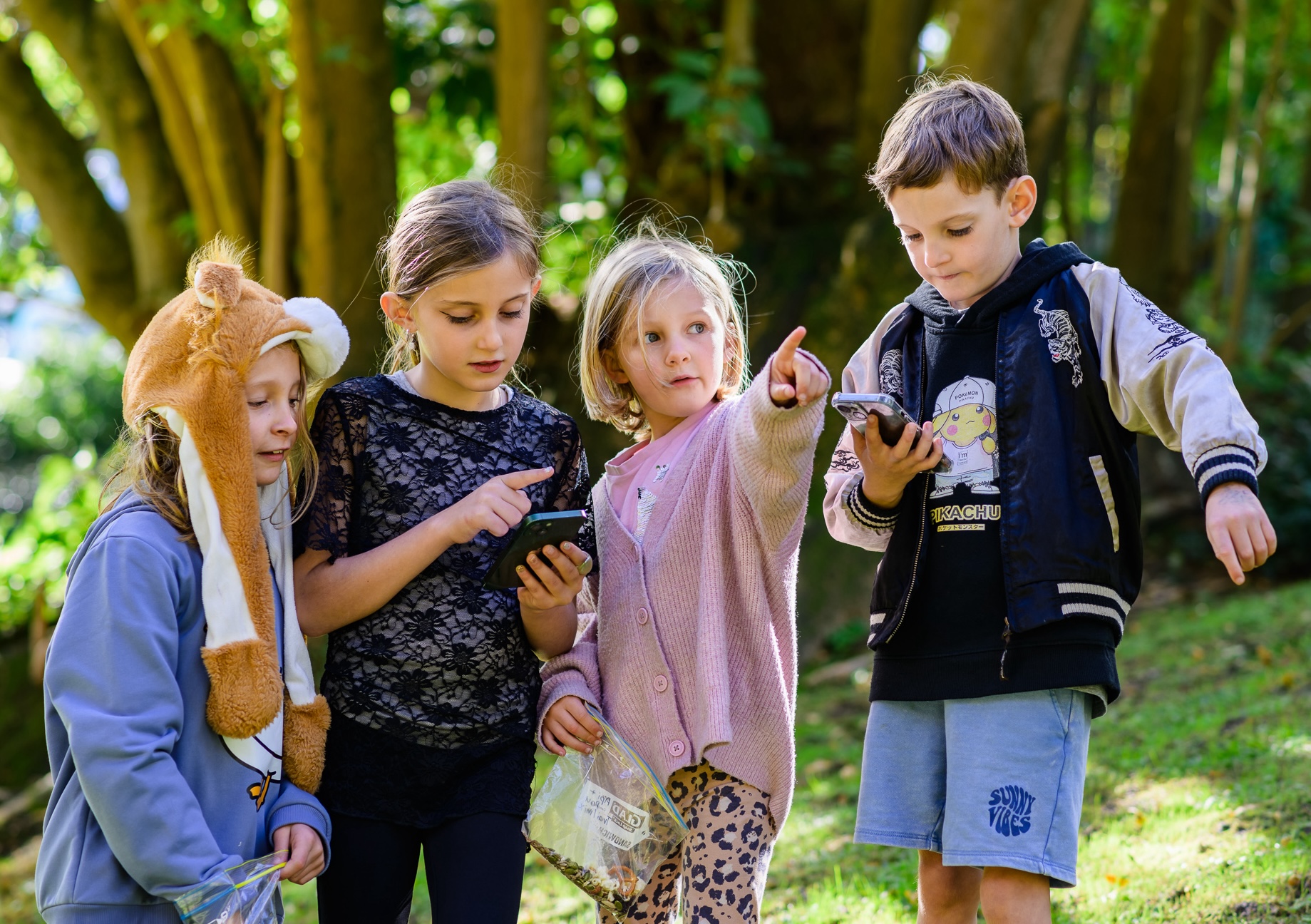 image of 4 children pointing to destination while using pickpath mobile app